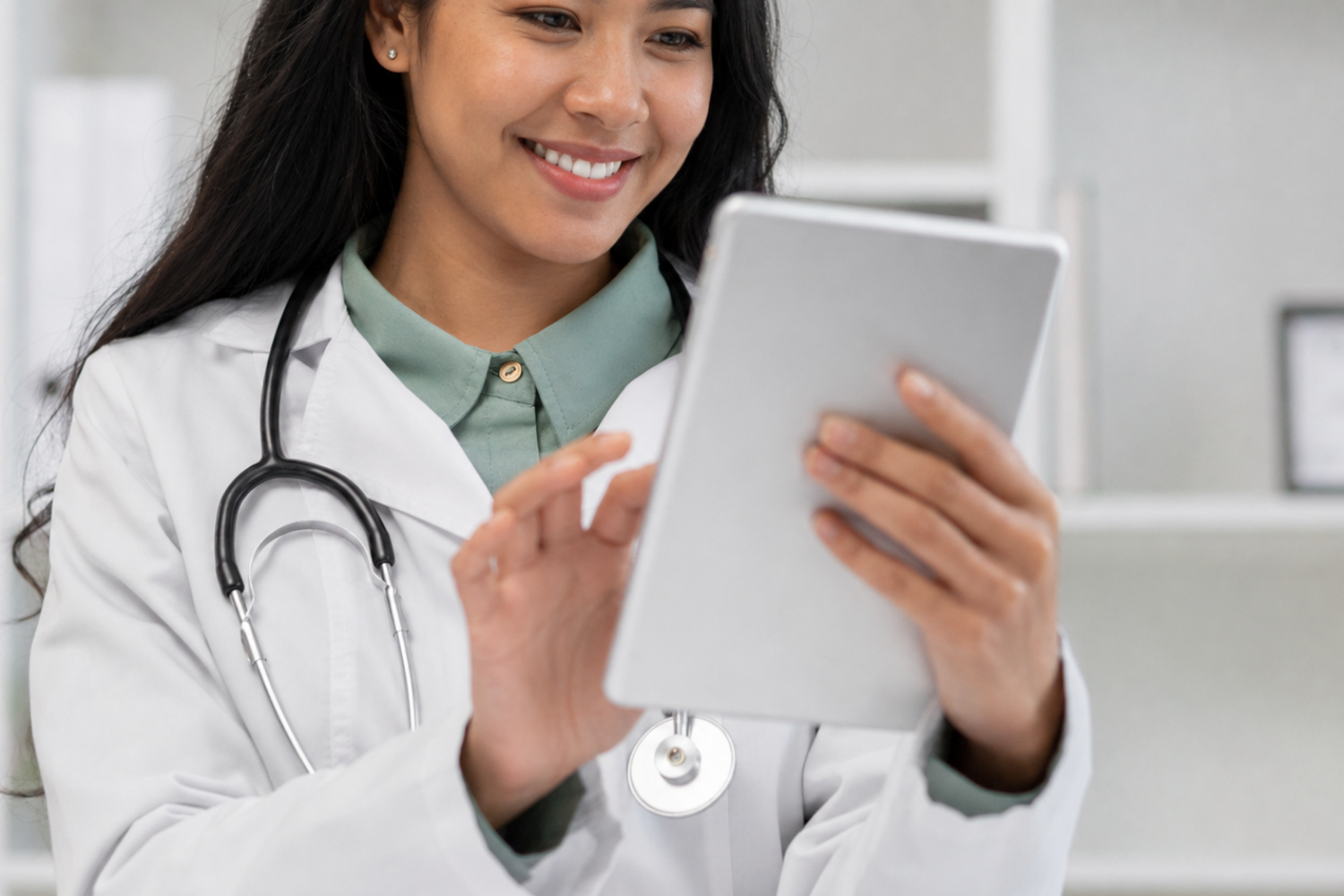 Doctor using a tablet for healthcare credentialing and provider onboarding work